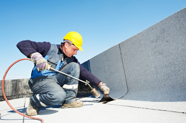 depositphotos 10460068 stock photo flat roof covering works with